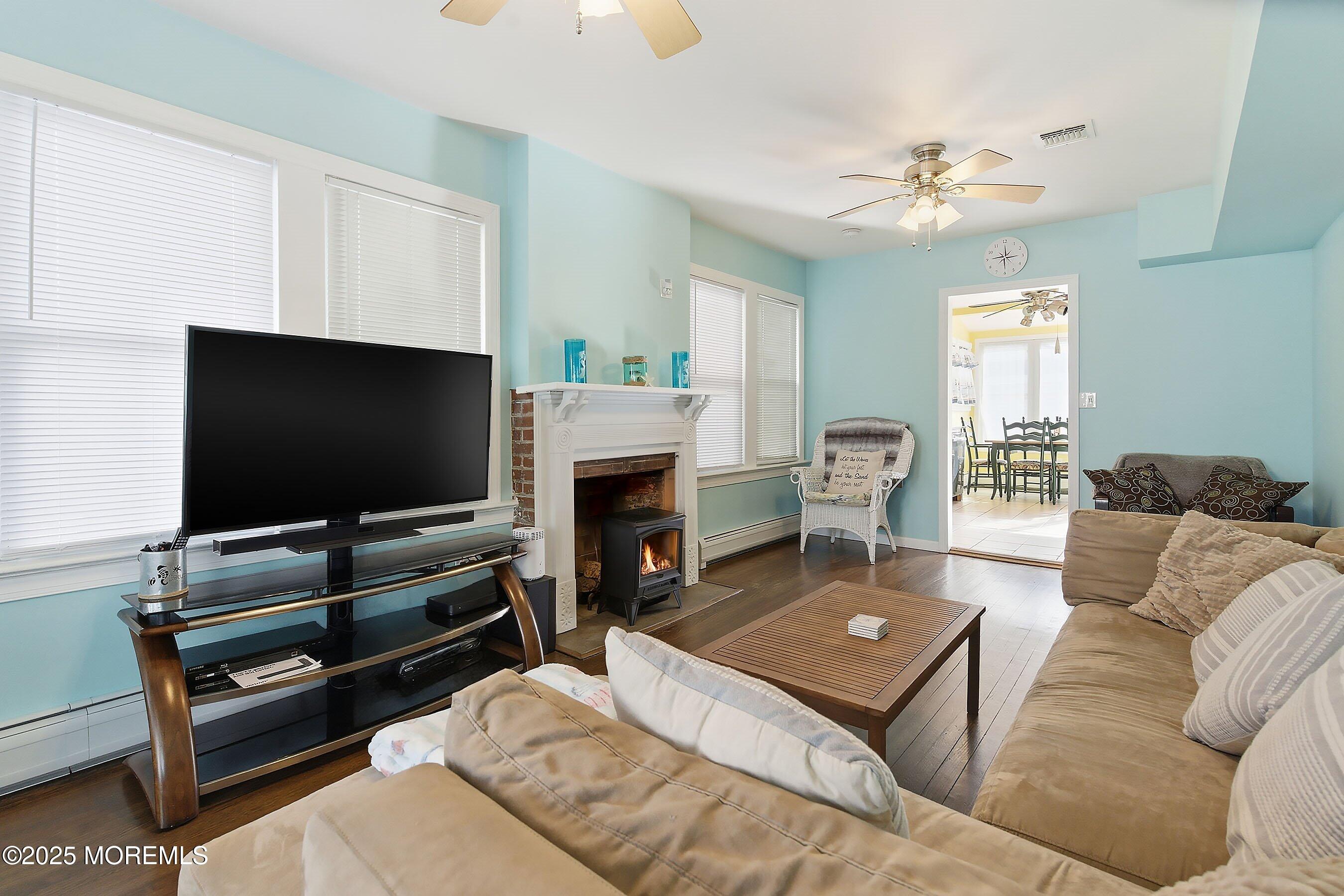 34 Waterview Way Sea Bright, NJ 07760 - Photo 10 of 24 a living room with furniture and a flat screen tv