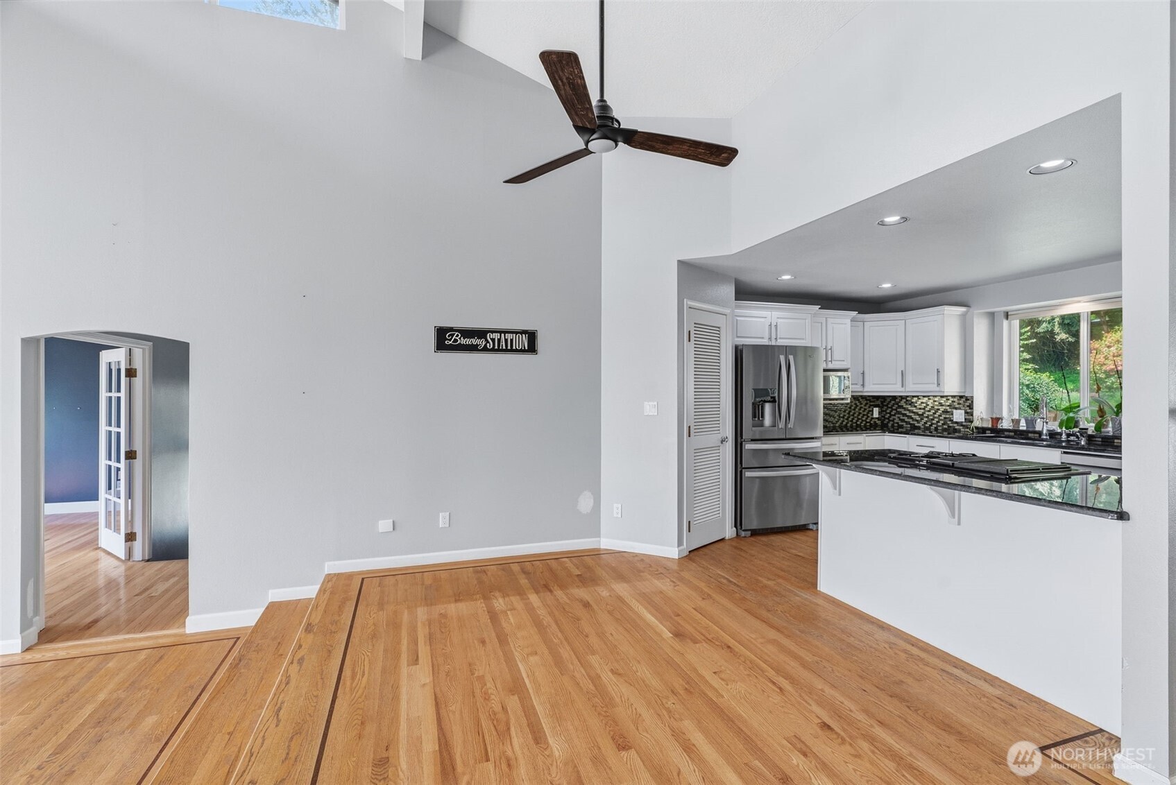 16 Little Cape Horn Road Cathlamet, WA 98612 - Photo 12 of 32 a kitchen with stainless steel appliances granite countertop a refrigerator a sink dishwasher a stove and white countertops with wooden floor
