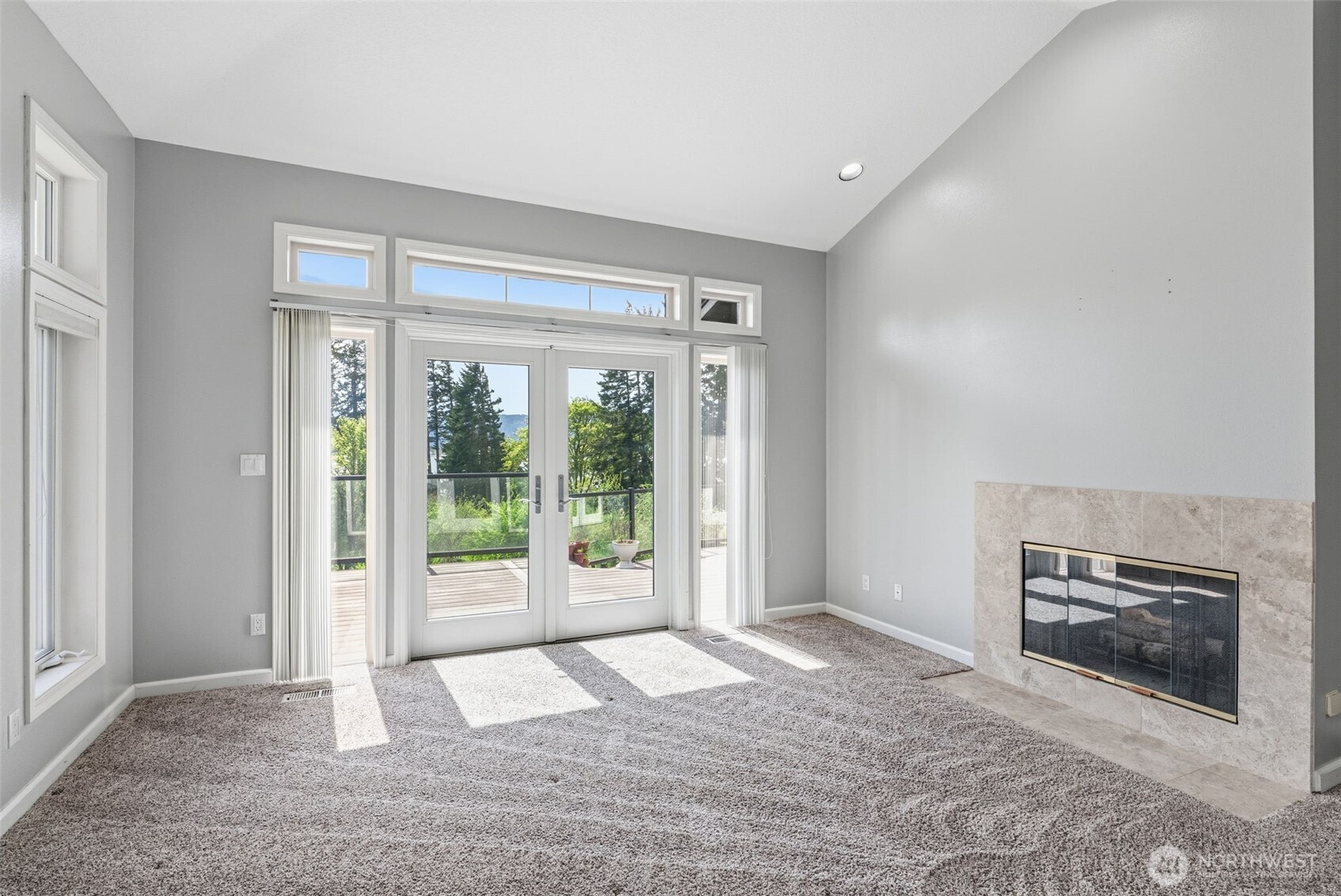 16 Little Cape Horn Road Cathlamet, WA 98612 - Photo 14 of 32 a view of an empty room with a fireplace and a window