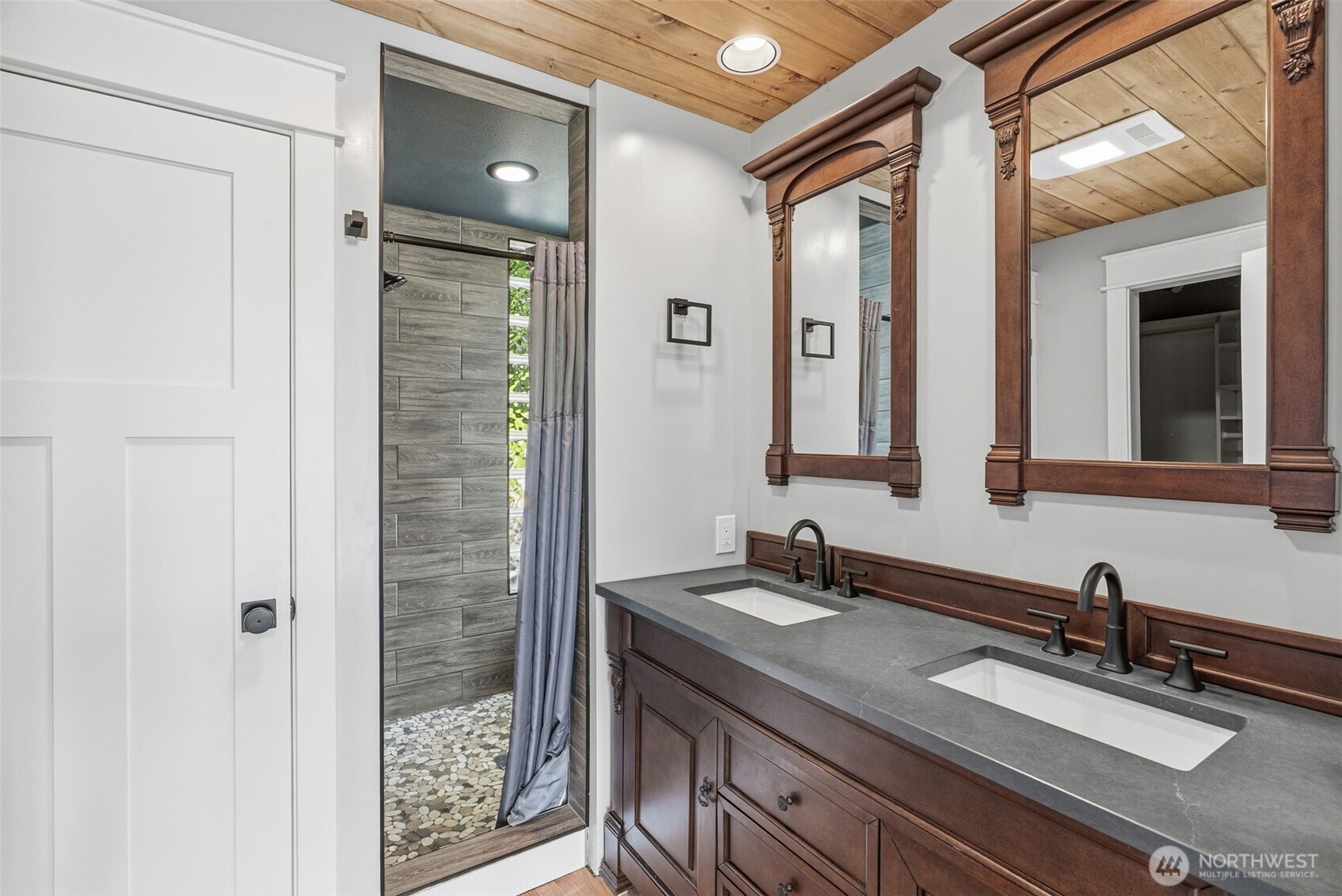 16 Little Cape Horn Road Cathlamet, WA 98612 - Photo 15 of 32 a bathroom with a granite countertop sink and a mirror
