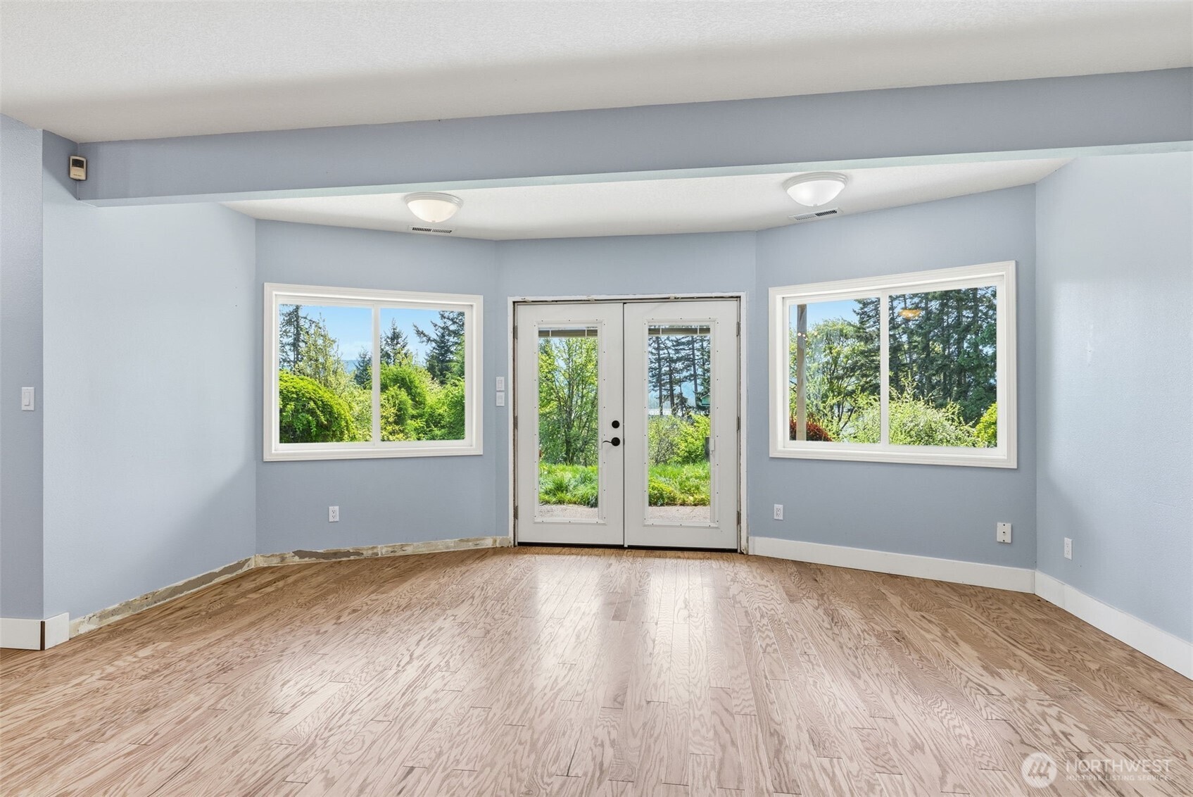 16 Little Cape Horn Road Cathlamet, WA 98612 - Photo 24 of 32 a view of an empty room with wooden floor and a window