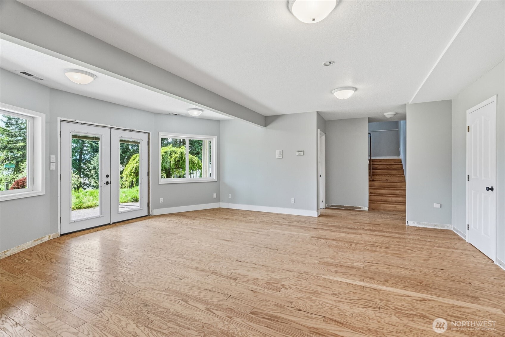 16 Little Cape Horn Road Cathlamet, WA 98612 - Photo 25 of 32 a view of an empty room with a window and wooden floor