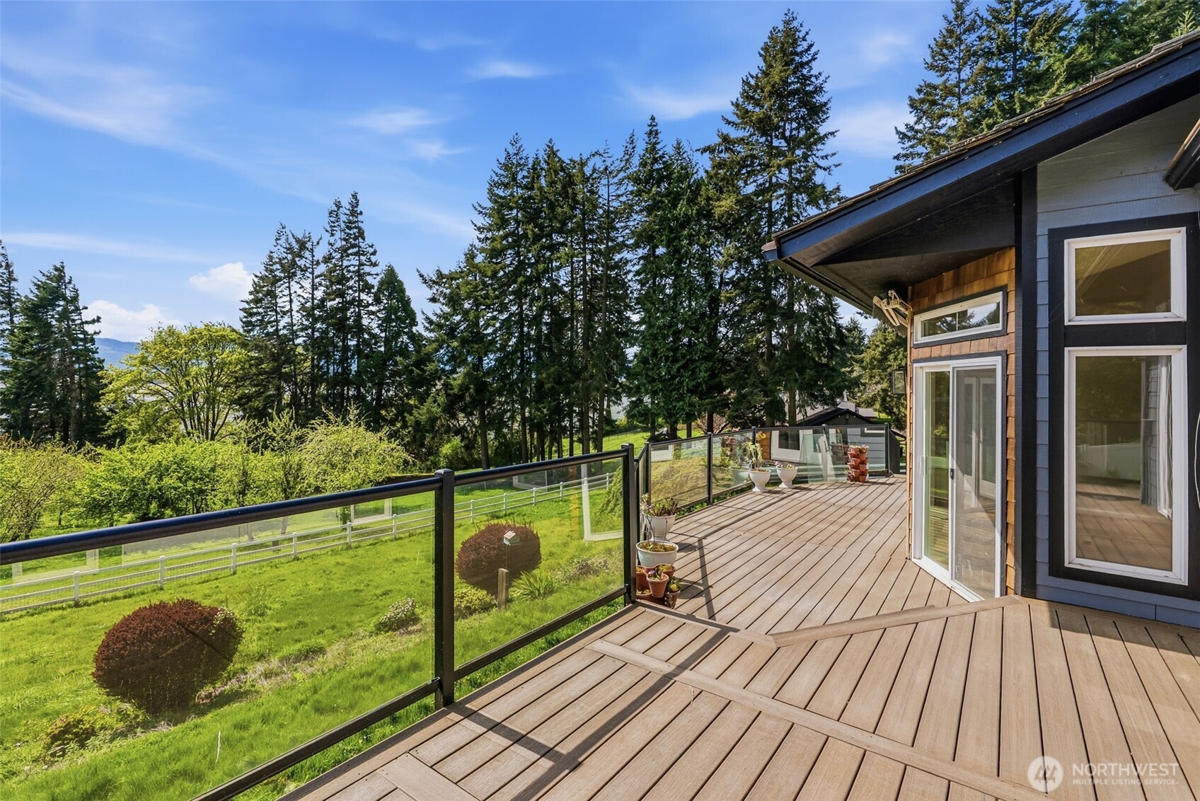 16 Little Cape Horn Road Cathlamet, WA 98612 - Photo 26 of 32 a view of swimming pool with seating space and trees in the background