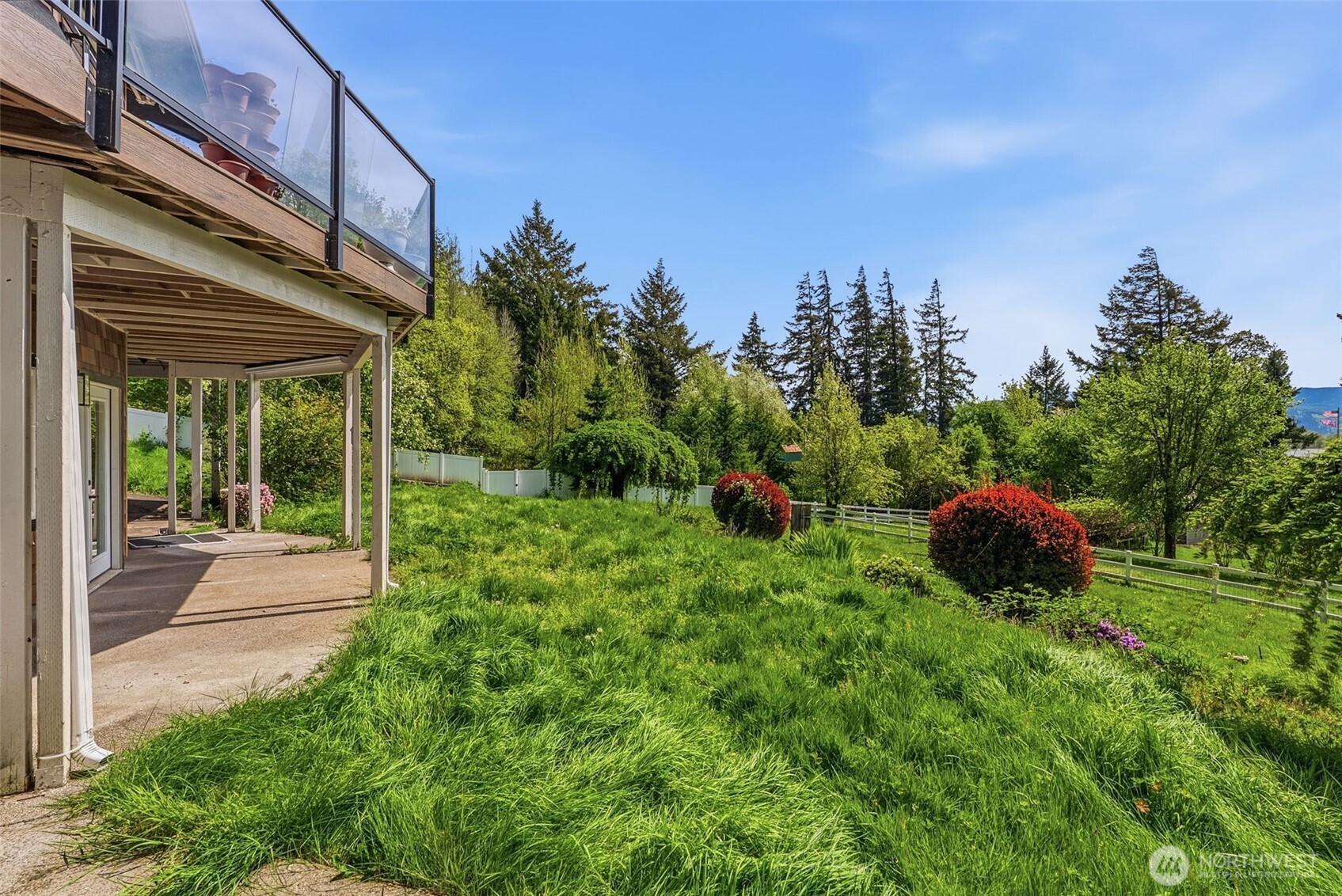16 Little Cape Horn Road Cathlamet, WA 98612 - Photo 29 of 32 a view of a garden with a bench in the garden
