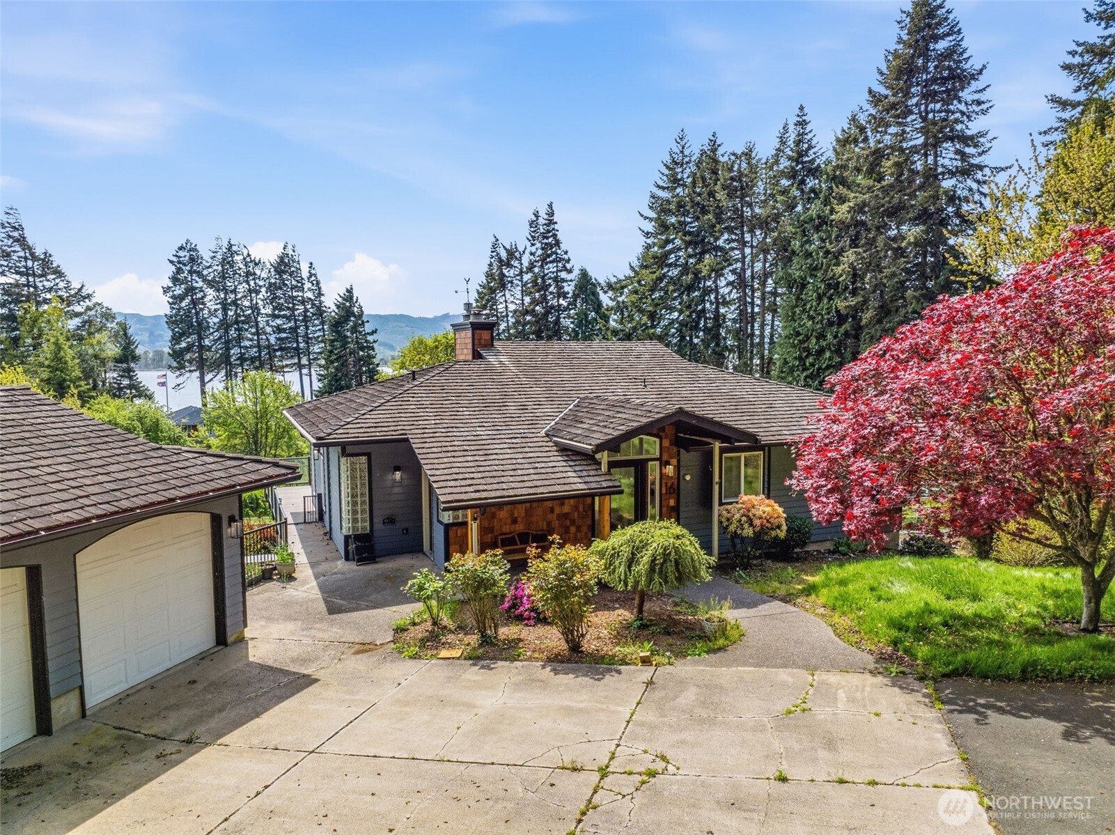 16 Little Cape Horn Road Cathlamet, WA 98612 - Photo 4 of 32 a house with lots of trees in the background