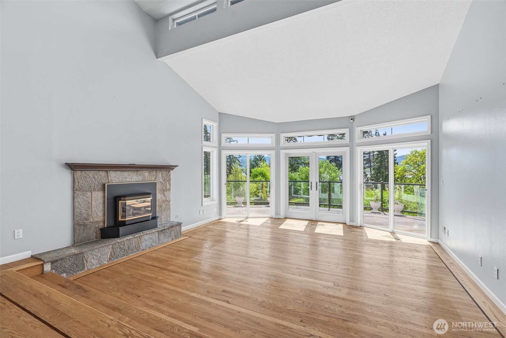 16 Little Cape Horn Road Cathlamet, WA 98612 - Photo 8 of 32 a view of an empty room with a window and wooden floor