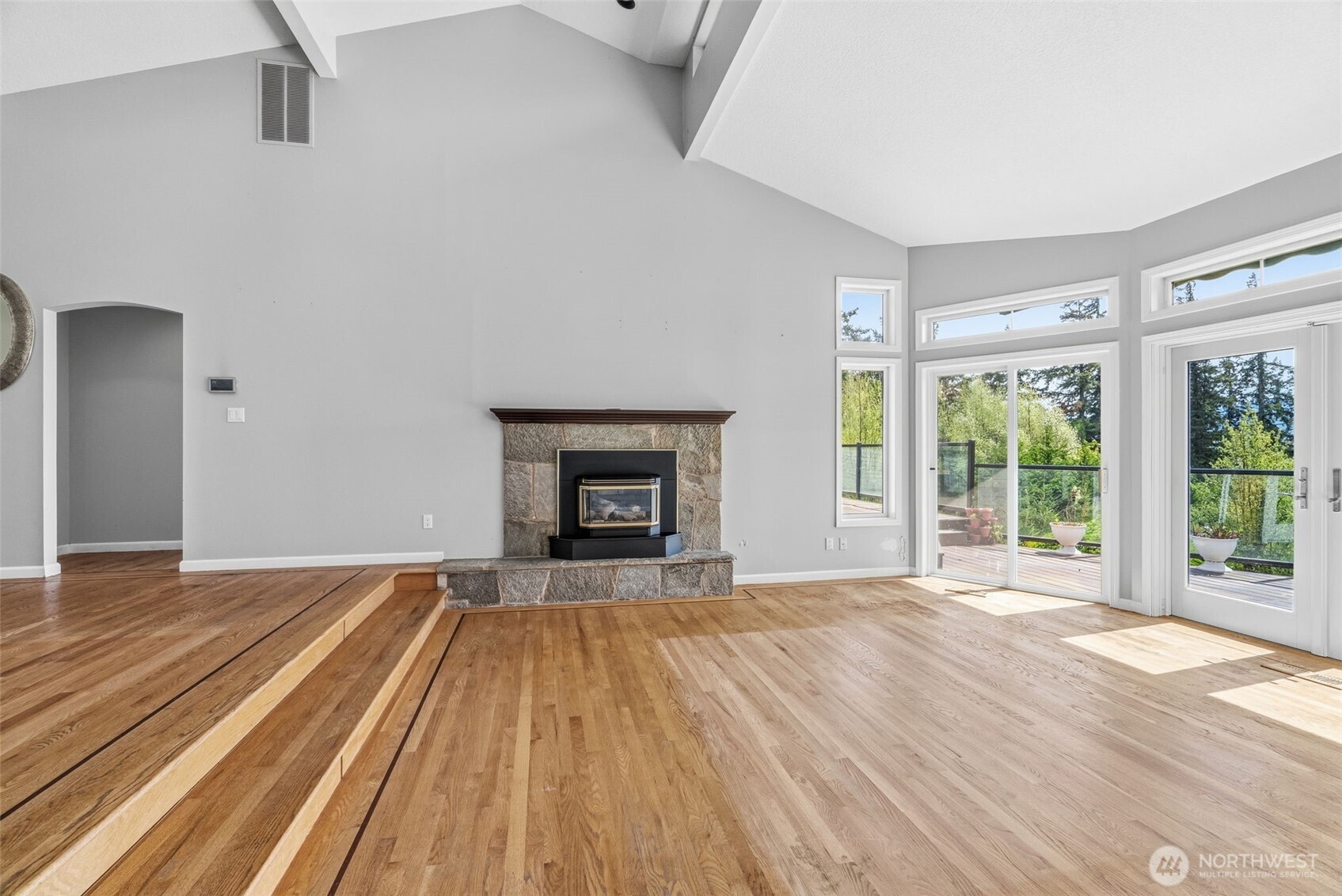 16 Little Cape Horn Road Cathlamet, WA 98612 - Photo 9 of 32 a view of empty room with wooden floor and fireplace