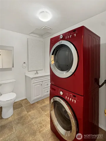 a kitchen with stainless steel appliances granite countertop a stove refrigerator and microwave