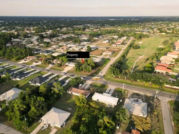 an aerial view of residential houses with outdoor space