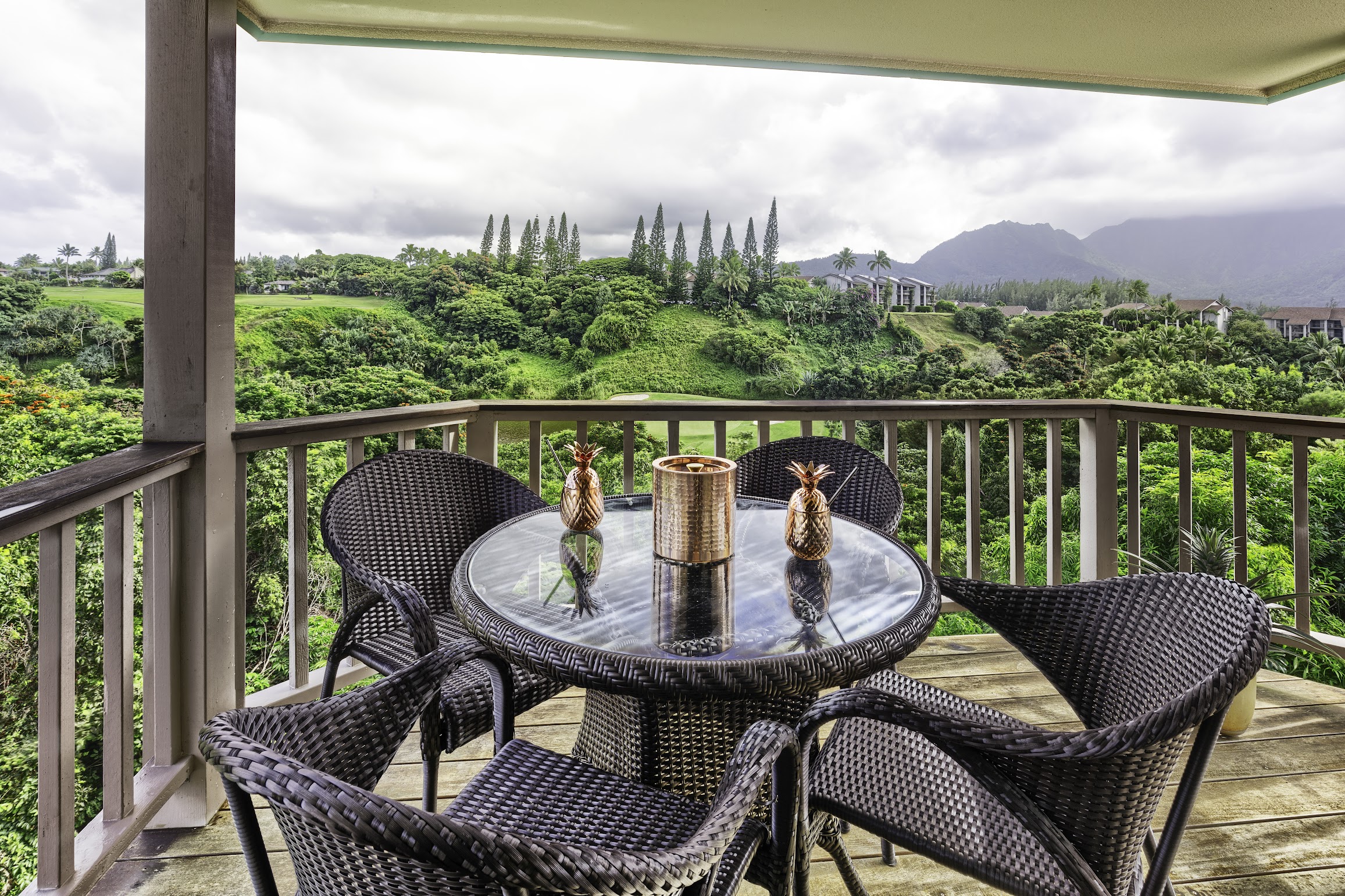 5451 Ka Haku Road, Unit 8 Princeville, HI 96722 - Photo 11 of 14 a view of a city from a balcony with furniture