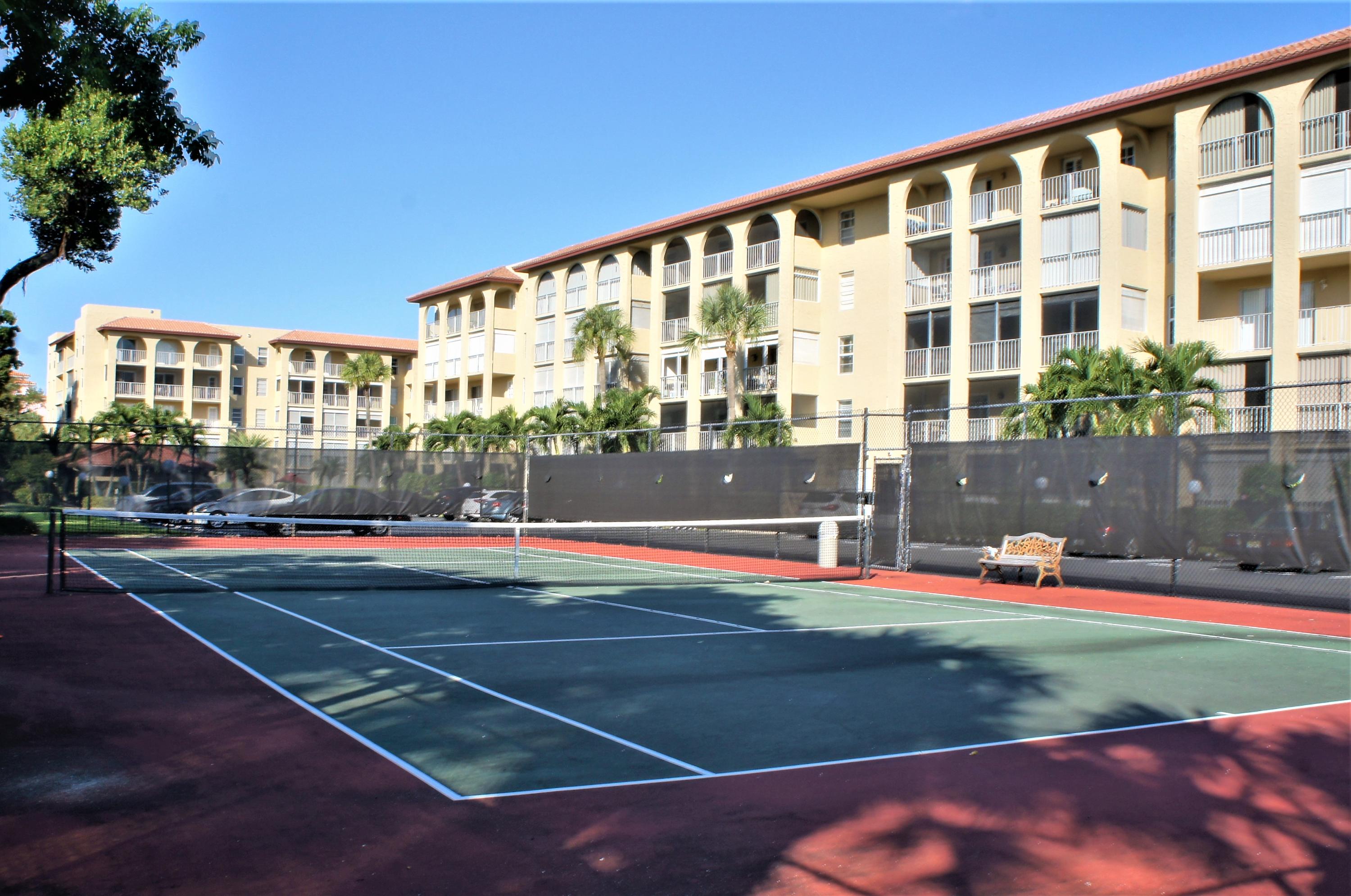 951 De Soto Road, Unit 234 Boca Raton, FL 33432 - Photo 5 of 44 a front view of building with yard