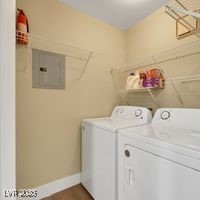 698 South Racetrack Road, Unit 412 Henderson, NV 89015 - Photo 18 of 25 Clothes washing area with washer and dryer, laundry area, baseboards, and electric panel