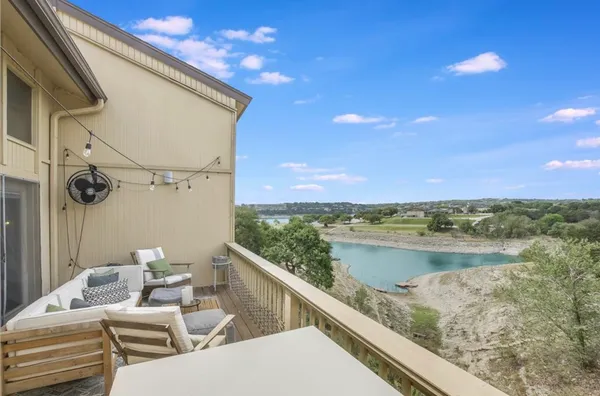 a view of balcony with furniture