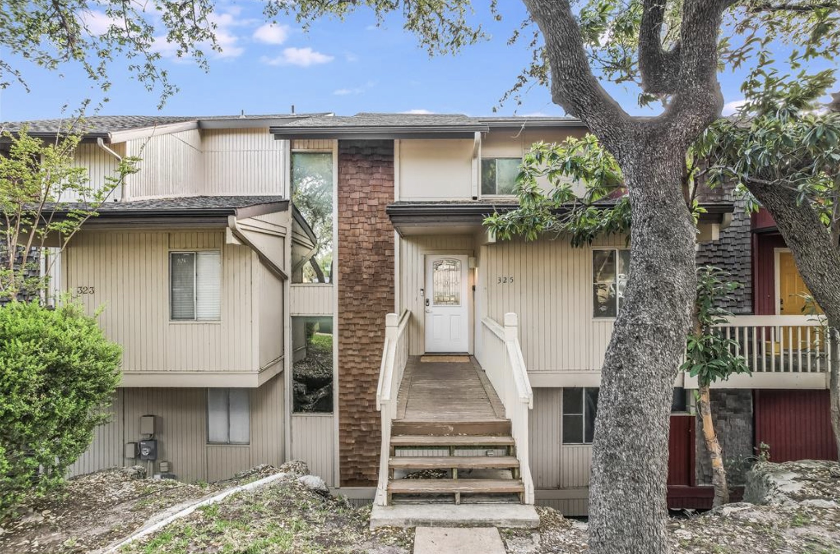 Undisclosed Address Point Venture, TX 78645 - Photo 5 of 31 a front view of a house with a tree