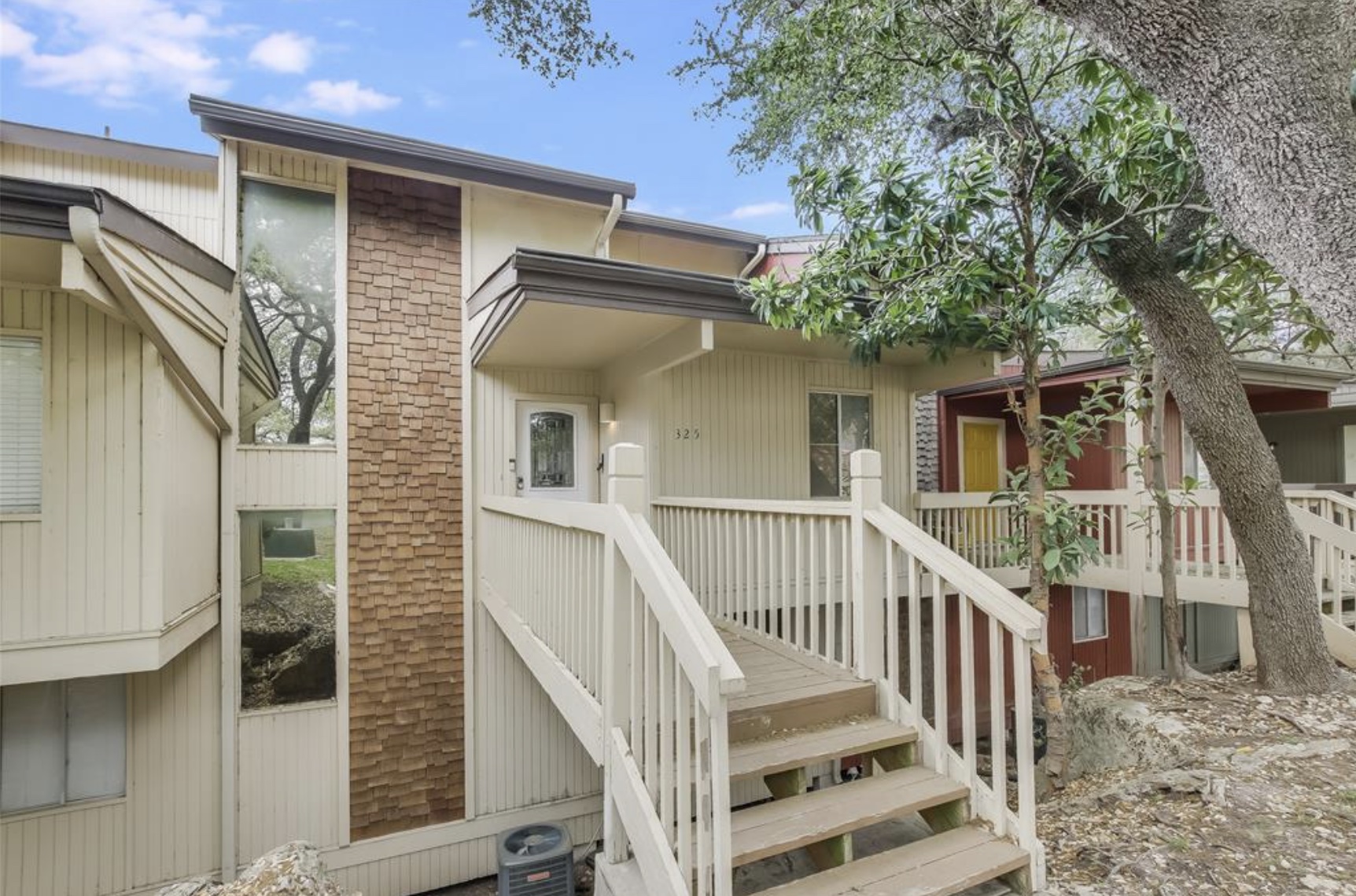 Undisclosed Address Point Venture, TX 78645 - Photo 7 of 31 a view of a house with wooden deck and a small yard