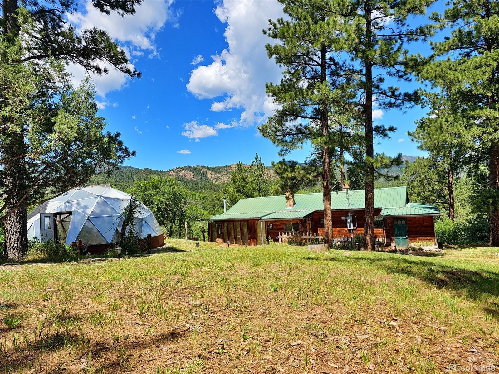 8929 Apache Drive Beulah, CO 81023 - Photo 1 of 43 a front view of a house with garden