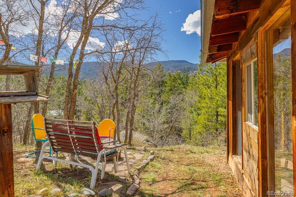 8929 Apache Drive Beulah, CO 81023 - Photo 13 of 43 a backyard of a house with table and chairs