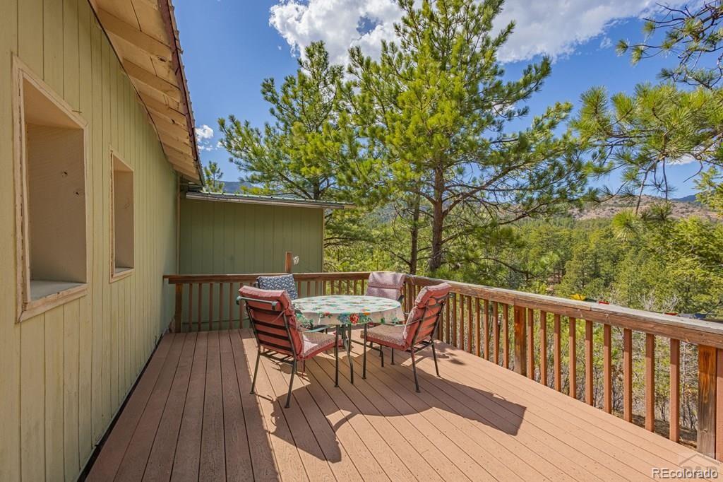 8929 Apache Drive Beulah, CO 81023 - Photo 22 of 43 a view of balcony with furniture and wooden deck