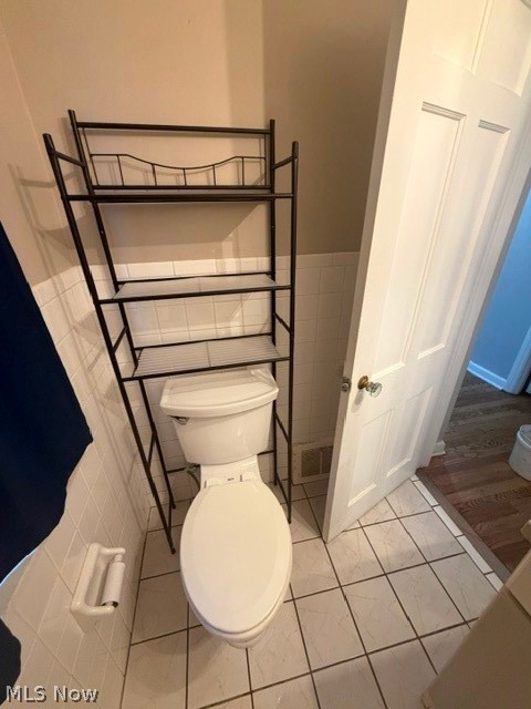 1388 Cranover Road Lyndhurst, OH 44124 - Photo 29 of 35 White tile flooring with dark grout and white ceramic wall tile