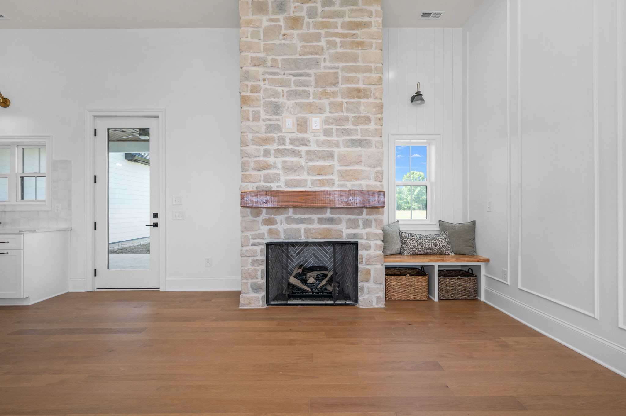 7838 Woodfin Road Christiana, TN 37037 - Photo 13 of 57 a view of empty room with wooden floor and fireplace