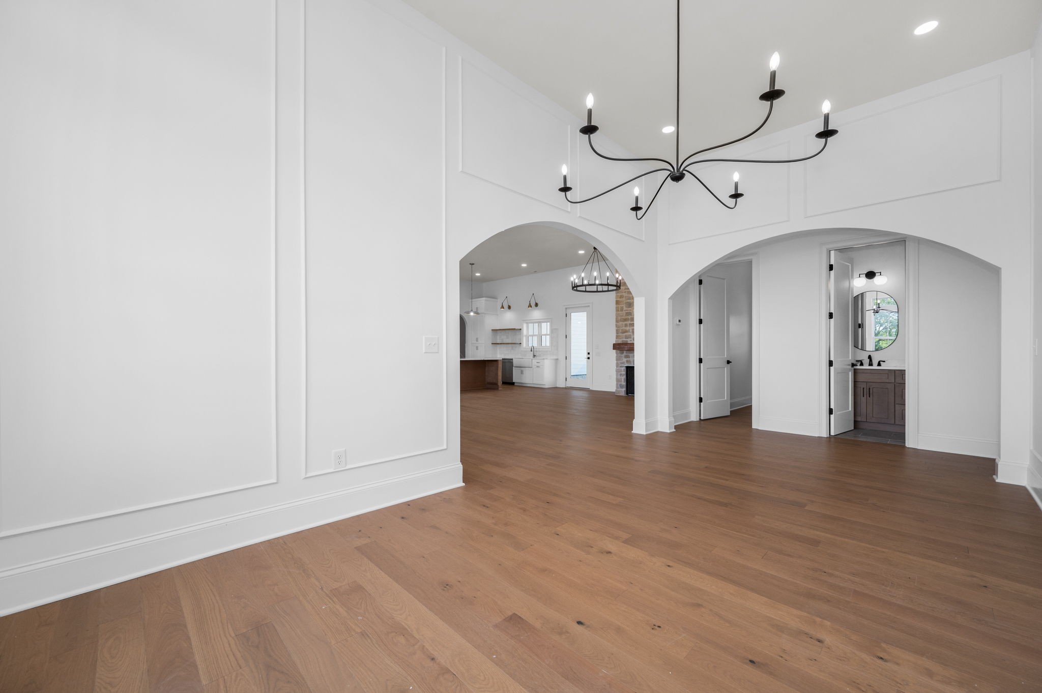 7838 Woodfin Road Christiana, TN 37037 - Photo 15 of 57 a view of a room with wooden floor white walls and ceiling windows