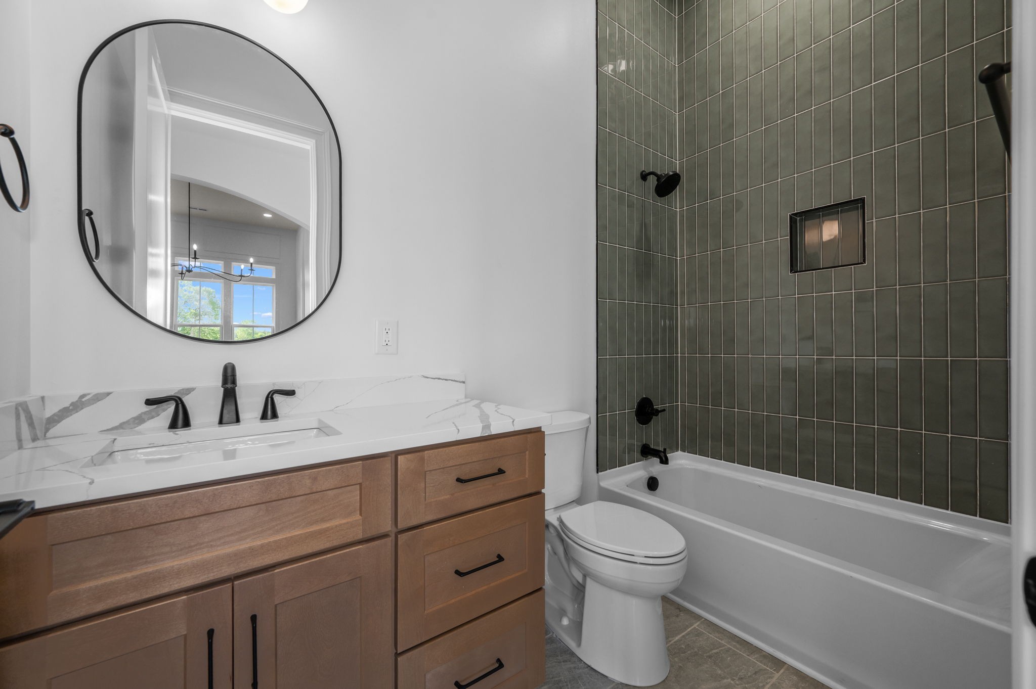 7838 Woodfin Road Christiana, TN 37037 - Photo 17 of 57 a bathroom with a toilet a sink a mirror and bathtub