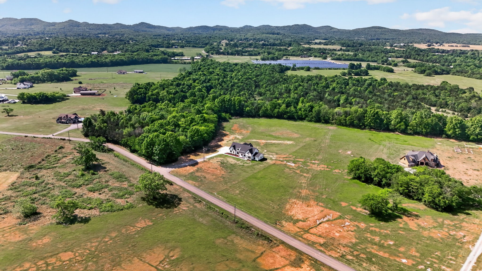 7838 Woodfin Road Christiana, TN 37037 - Photo 2 of 57 a view of a lake with a mountain