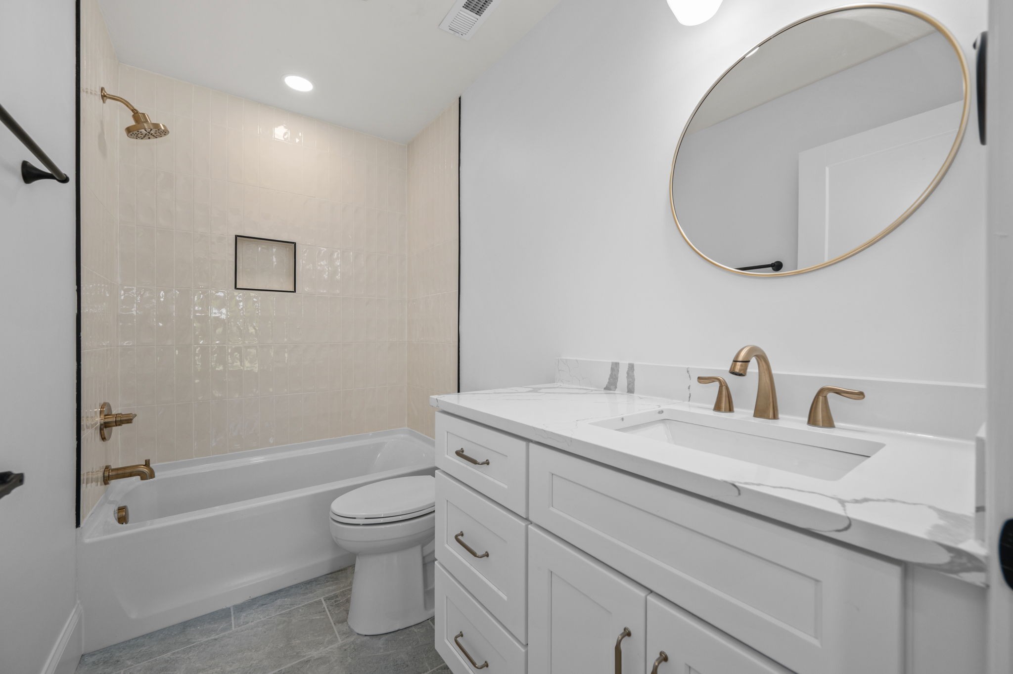 7838 Woodfin Road Christiana, TN 37037 - Photo 23 of 57 a bathroom with a granite countertop toilet a sink and a mirror