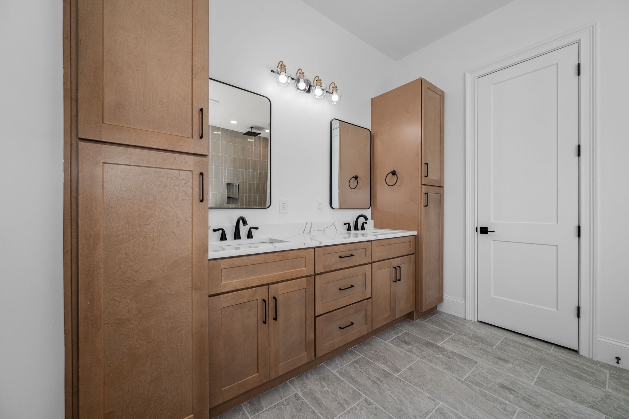 7838 Woodfin Road Christiana, TN 37037 - Photo 33 of 57 a spacious bathroom with a double vanity sink double and mirror