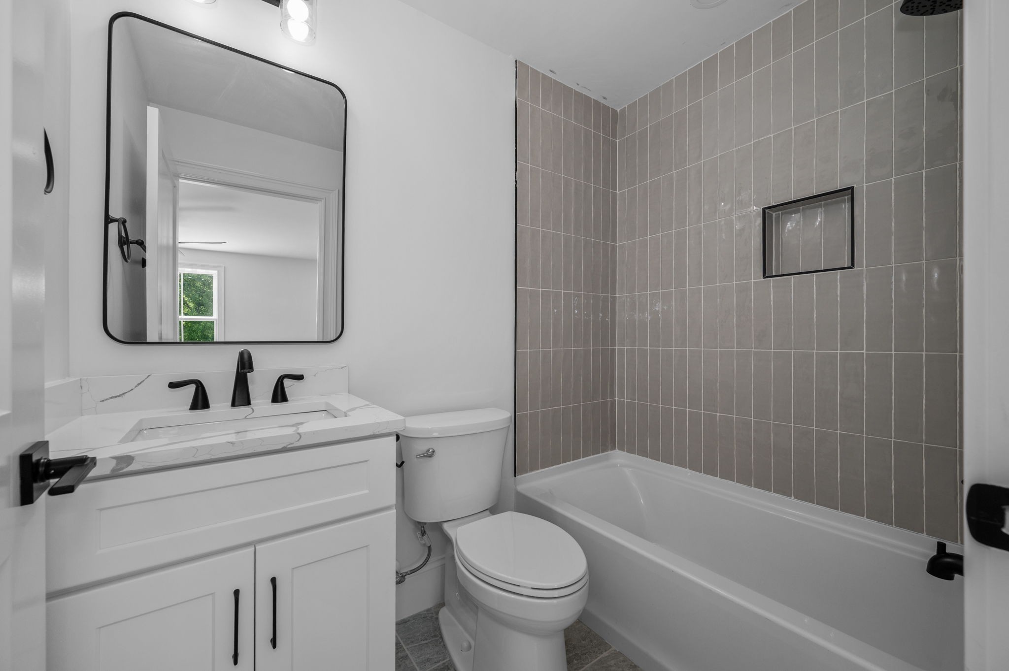 7838 Woodfin Road Christiana, TN 37037 - Photo 38 of 57 a bathroom with a sink toilet and shower