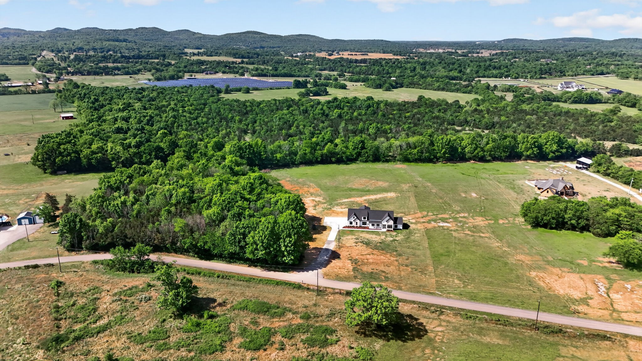 7838 Woodfin Road Christiana, TN 37037 - Photo 43 of 57 an aerial view of residential houses with outdoor space and trees