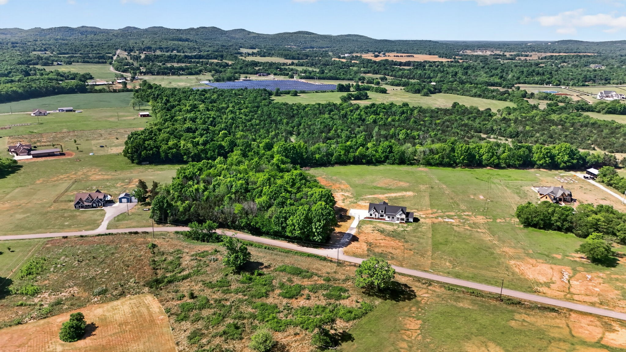 7838 Woodfin Road Christiana, TN 37037 - Photo 44 of 57 an aerial view of a houses with a yard