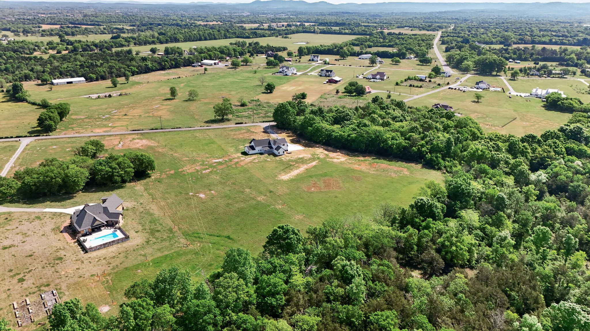 7838 Woodfin Road Christiana, TN 37037 - Photo 49 of 57 an aerial view of residential houses with outdoor space and trees