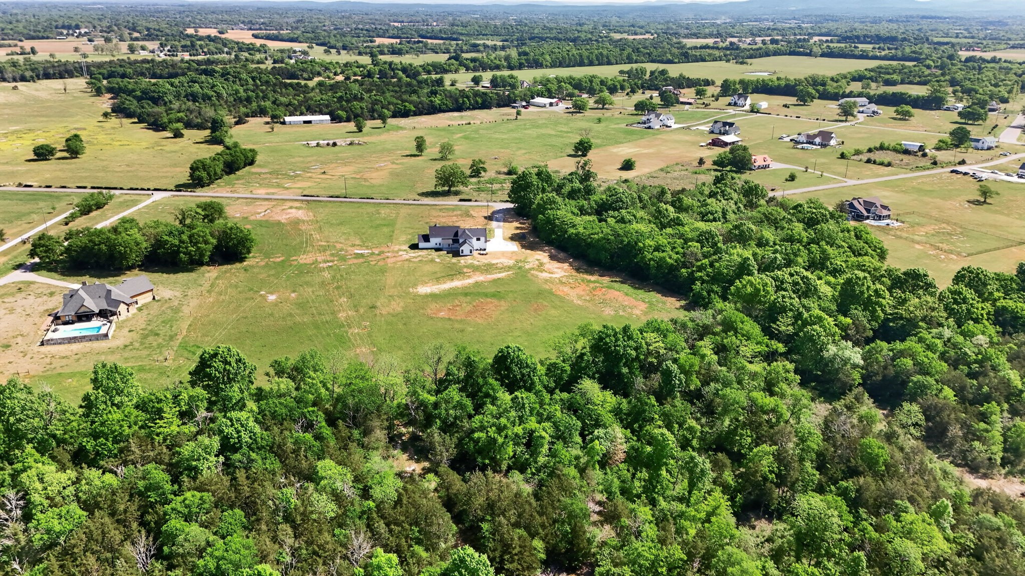 7838 Woodfin Road Christiana, TN 37037 - Photo 50 of 57 an aerial view of residential houses with outdoor space and river view