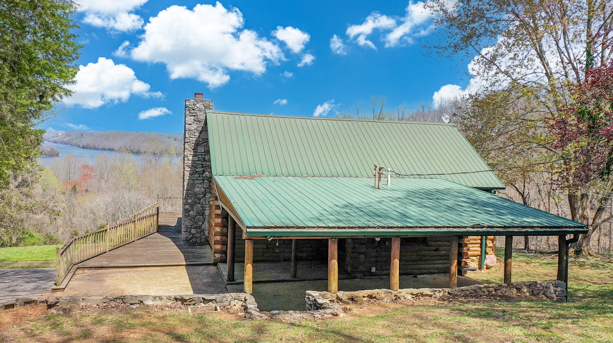 94 Scenic Road Normandy, TN 37360 - Photo 3 of 34 a front view of a house with a yard