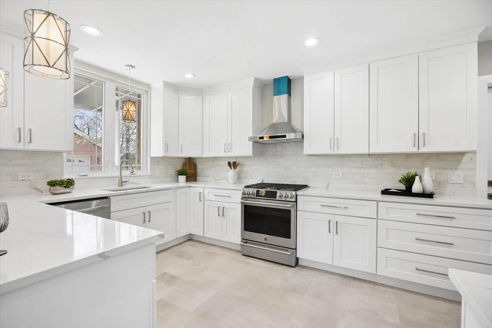 9807 West 57th Street Countryside, IL 60525 - Photo 14 of 48 a kitchen with granite countertop white cabinets white stainless steel appliances with a sink and dishwasher
