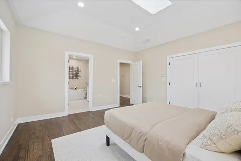 a bedroom with a bed and closet
