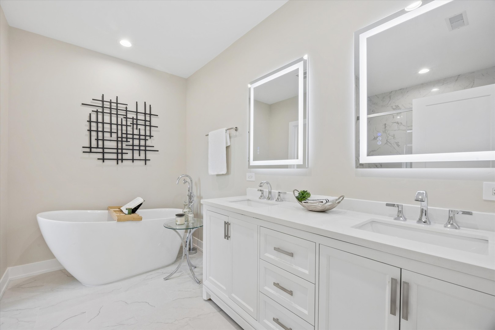 9807 West 57th Street Countryside, IL 60525 - Photo 22 of 48 a bathroom with a double vanity sink a mirror and a bathtub