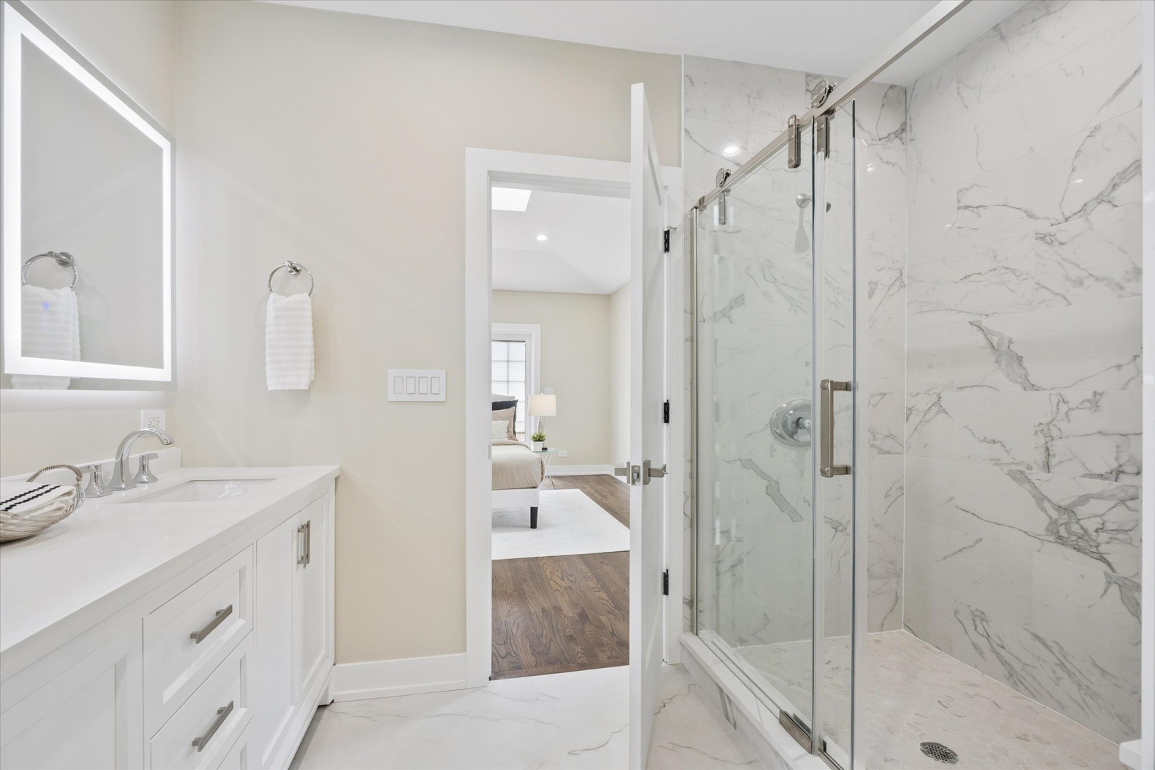 9807 West 57th Street Countryside, IL 60525 - Photo 23 of 48 a bathroom with a granite countertop sink mirror and shower