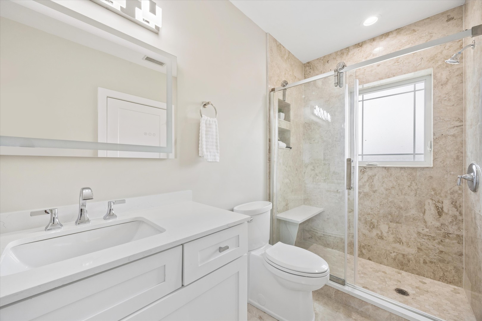 9807 West 57th Street Countryside, IL 60525 - Photo 26 of 48 a bathroom with a sink toilet and shower