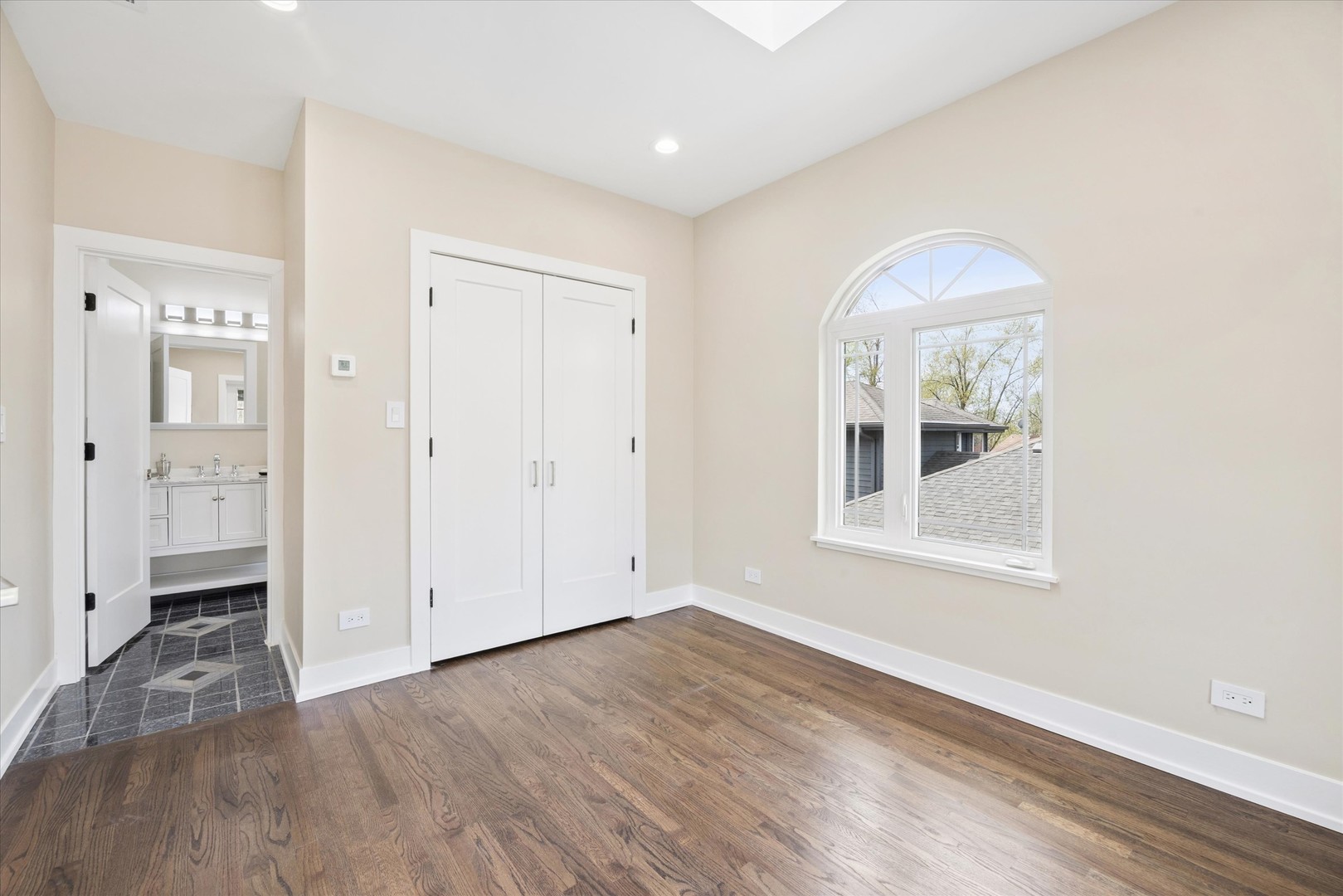 9807 West 57th Street Countryside, IL 60525 - Photo 28 of 48 wooden floor in an empty room with a window