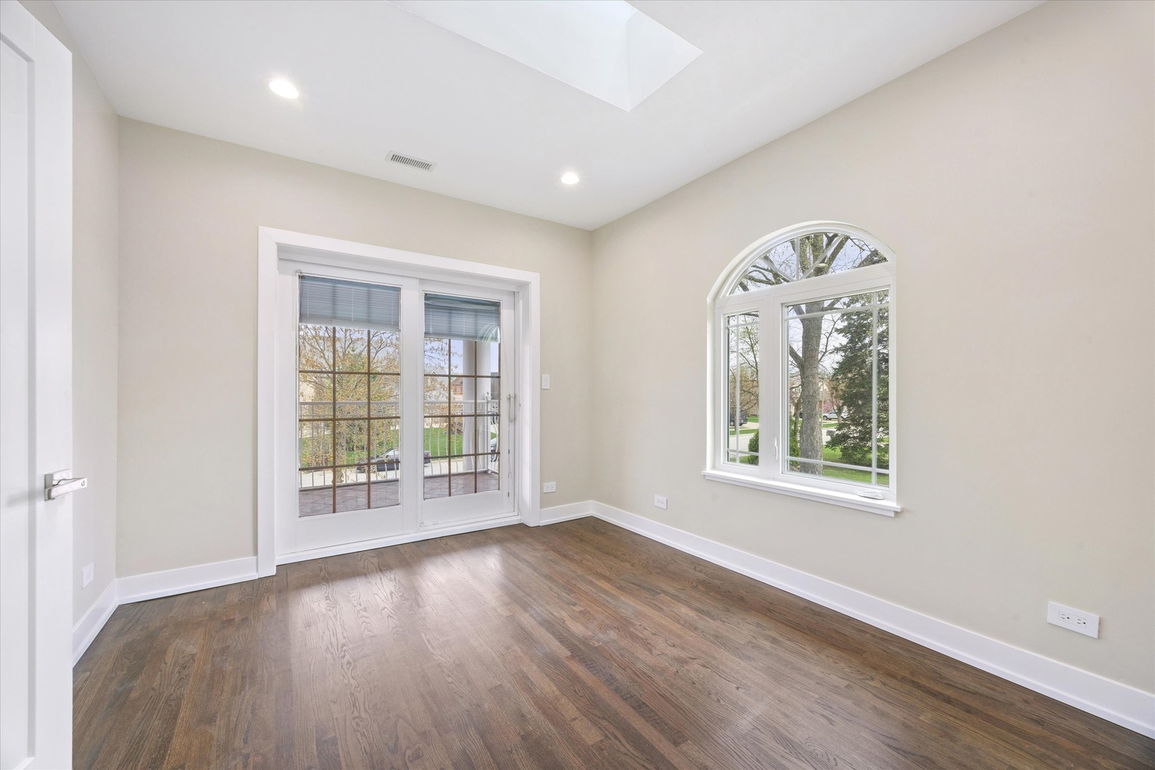 9807 West 57th Street Countryside, IL 60525 - Photo 30 of 48 wooden floor in an empty room with a window
