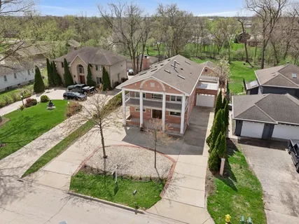 an aerial view of a house with a garden and plants