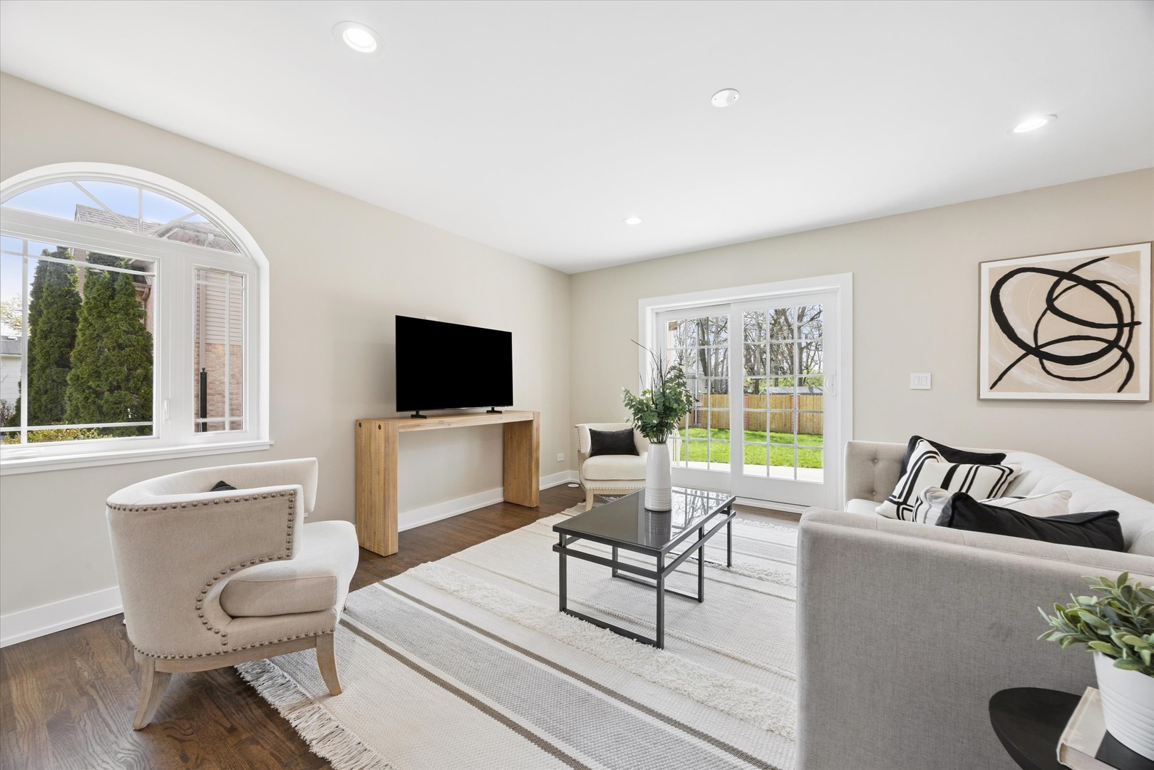 9807 West 57th Street Countryside, IL 60525 - Photo 7 of 48 a living room with furniture and a flat screen tv