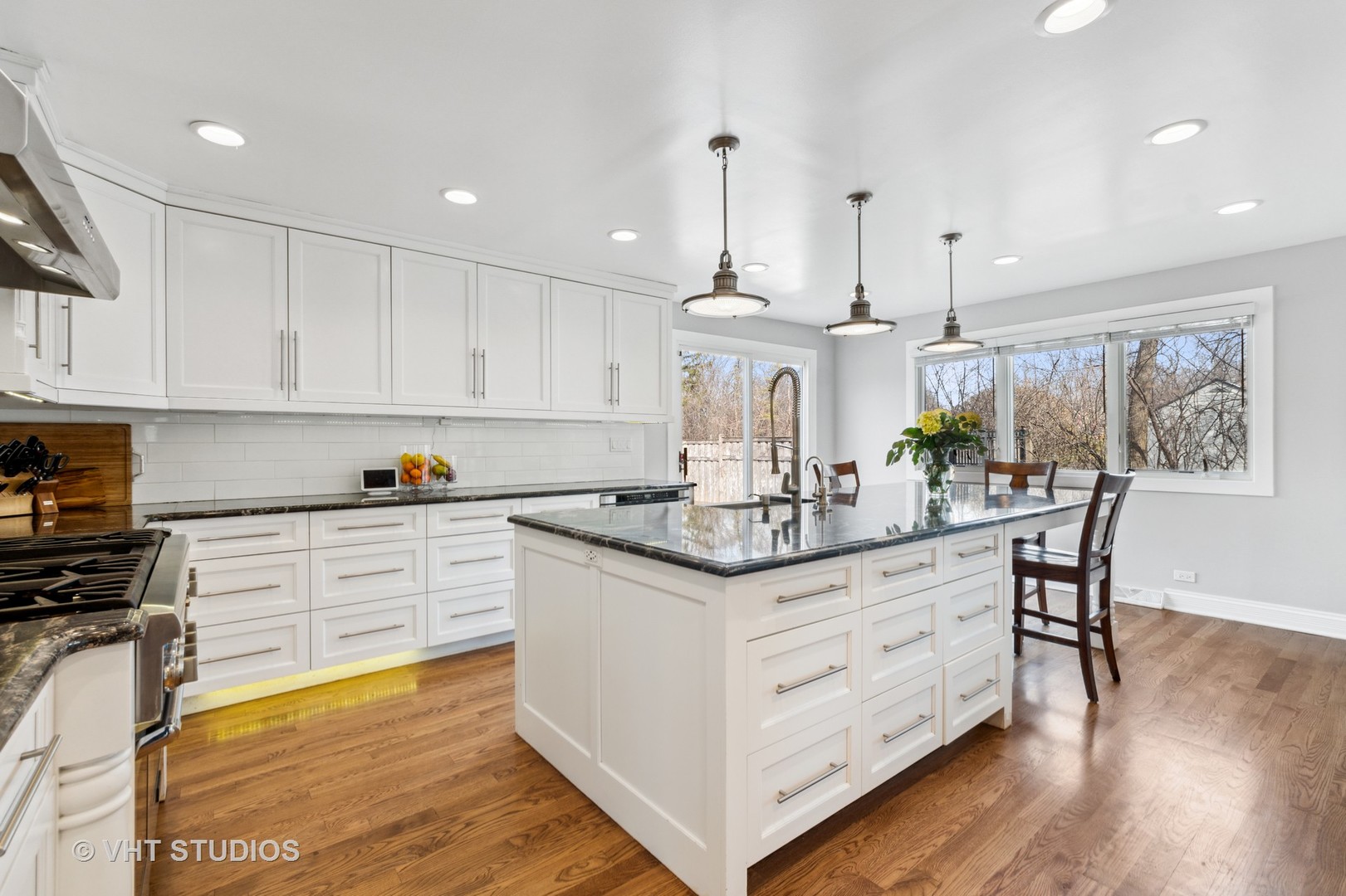 2079 Old Briar Road Highland Park, IL 60035 - Photo 13 of 20 a kitchen with stainless steel appliances granite countertop a sink a stove and a wooden floors