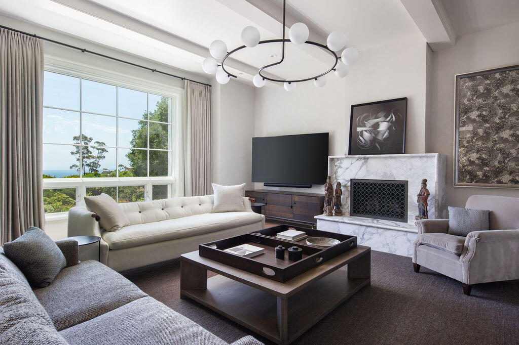 857 Picacho Lane Santa Barbara, CA 93108 - Photo 15 of 46 a living room with furniture a flat screen tv and a fireplace