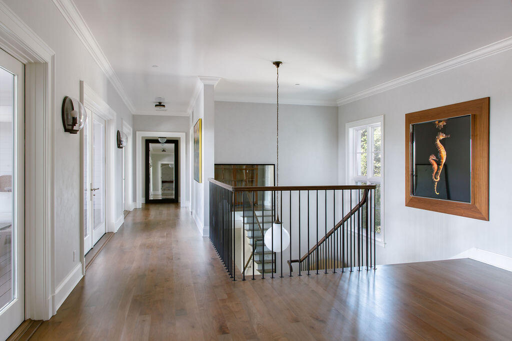 857 Picacho Lane Santa Barbara, CA 93108 - Photo 21 of 46 a view of a hallway with wooden floor windows