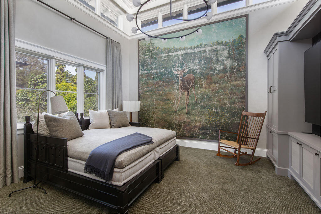 857 Picacho Lane Santa Barbara, CA 93108 - Photo 22 of 46 a bedroom with a bed and a flat tv screen next to a window