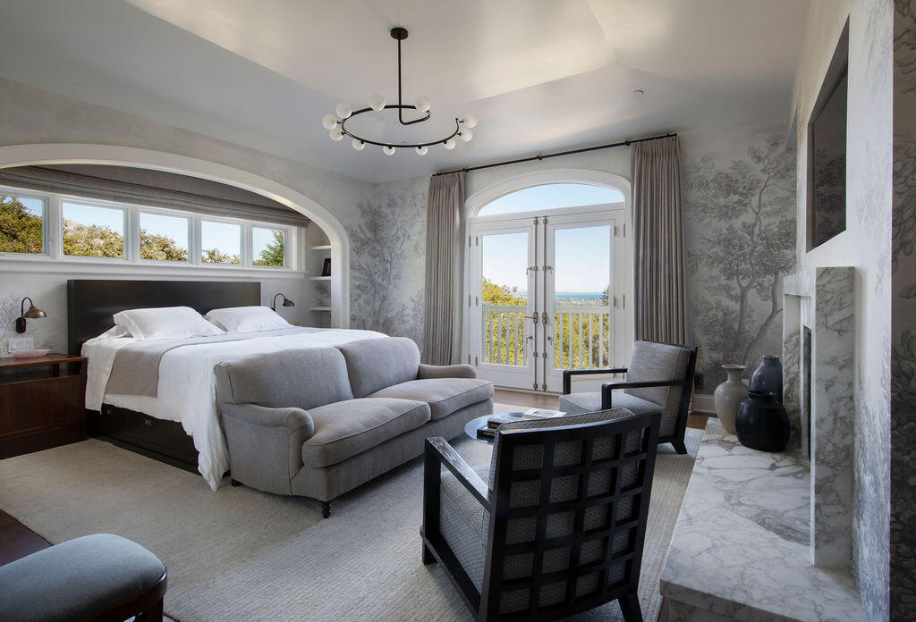 857 Picacho Lane Santa Barbara, CA 93108 - Photo 23 of 46 a bedroom with a bed and a chandelier