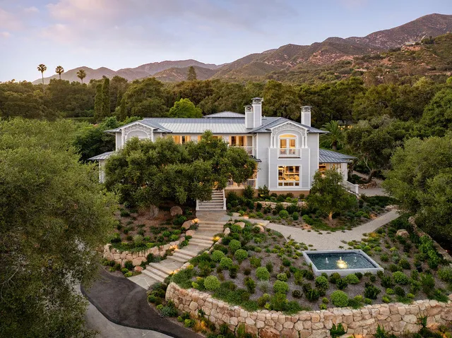 an aerial view of a house with a garden